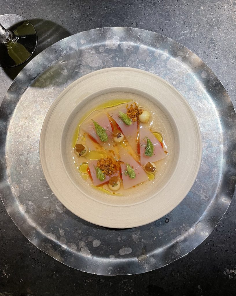 Thin slices of scoby with rosehip berries, apple and a quince broth