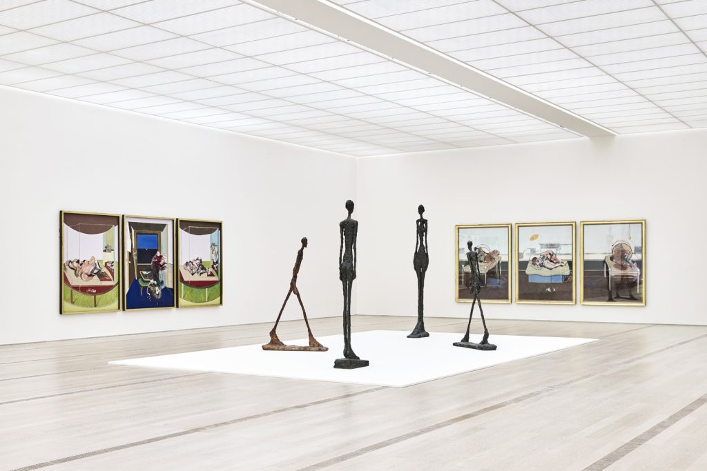 Alberto-Giacometti-Sculpture-with-Picasso-paintings-See-All-This-Art-Magazine.jpeg