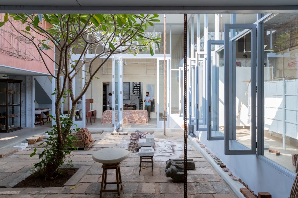 The central courtyard with a tree and installations made from brick