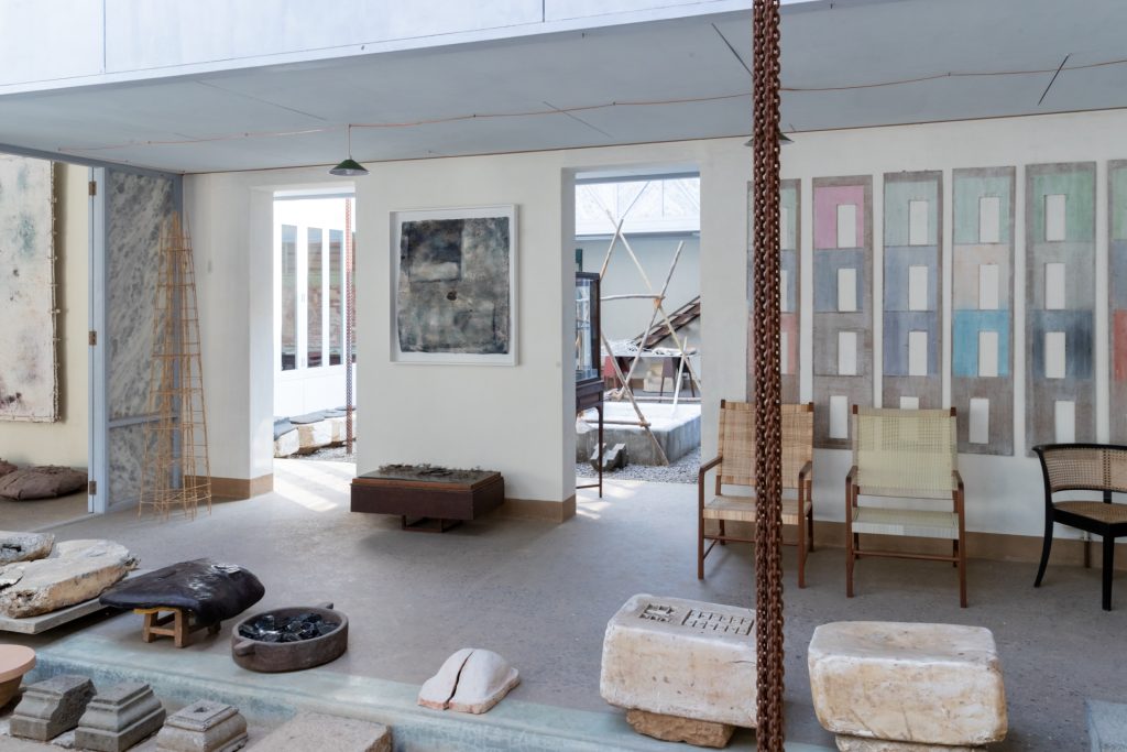 The open spaces around the central courtyard offer a view of a second, smaller courtyard