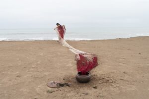 Cristina Flores Pescorán, Mama Protectora: Que respire la herida, 2021, performance with textile work, woven in cotton and sheep wool dyed with cochineal |© Cristina Flores Pescoran, photo: Isidro Lambarri