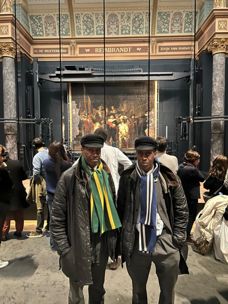 The Islington Twins in front of Rembrandt's Nightwatch at the Rijksmuseum, Amsterdam, 7 December 2025